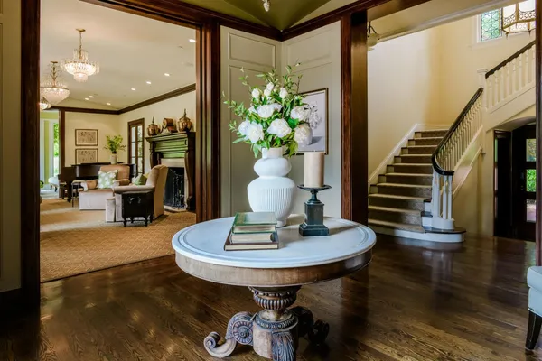 a dining room with furniture and wooden floor