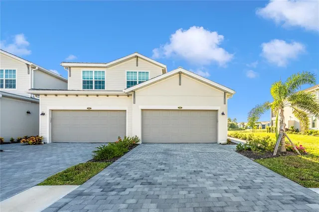 a dining room with furniture and a mirror
