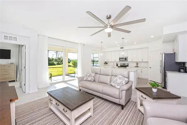 a view of a livingroom with furniture and a flat screen tv