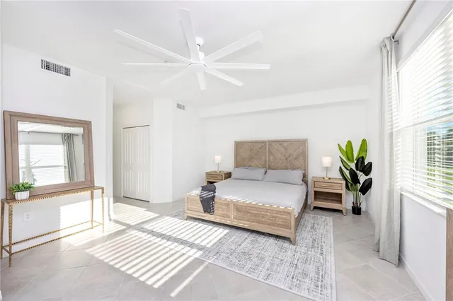 a bedroom with a bed and a night stand