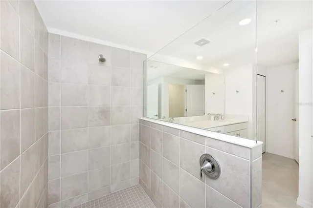 a living room with a floor to ceiling window and pool
