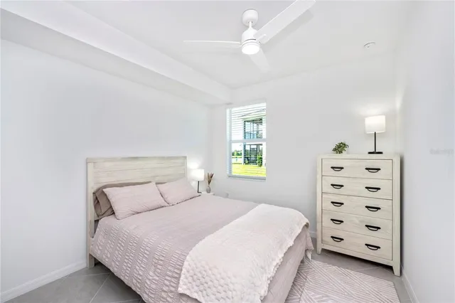 a group of people sitting in front of a yellow house