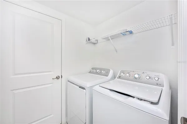 a view of a room with gym equipment and a large window