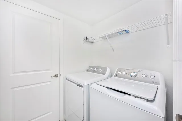 a view of a room with gym equipment and a large window