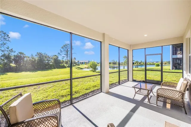 a living room with lots of furniture and a chandelier