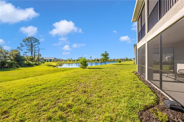 a view of a swimming pool with an ocean and trees
