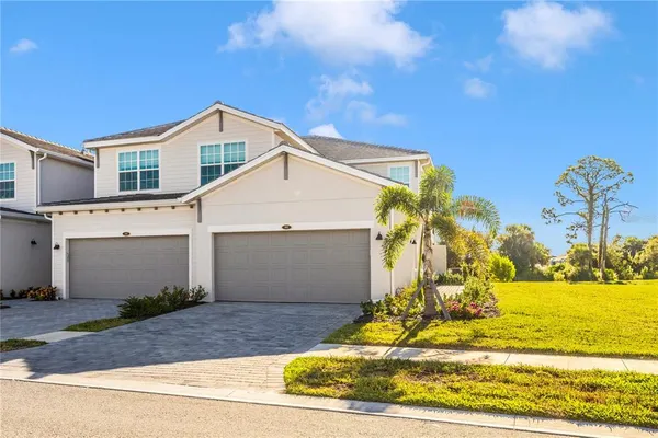 a view of house with swimming pool outdoor seating