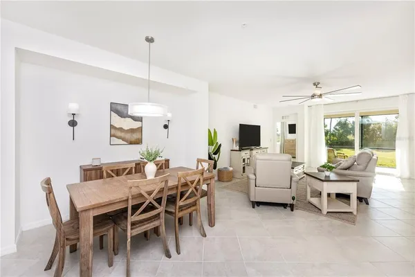 a kitchen with kitchen island a sink stove and refrigerator