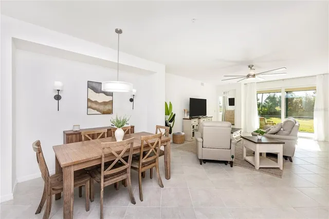 a kitchen with kitchen island a sink stove and refrigerator