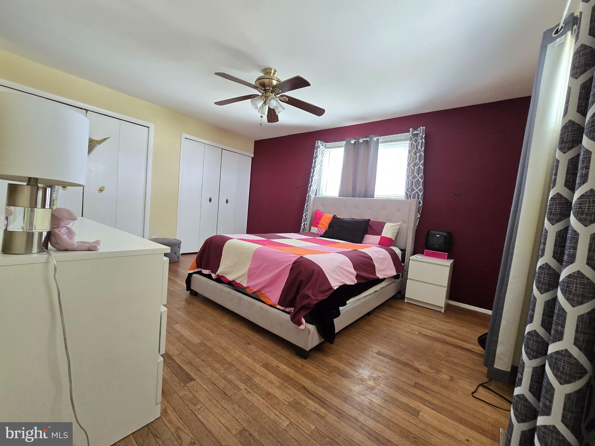 9003 Bruno Road Randallstown, MD 21133 - Photo 13 of 25 a bedroom with a bed and a chandelier