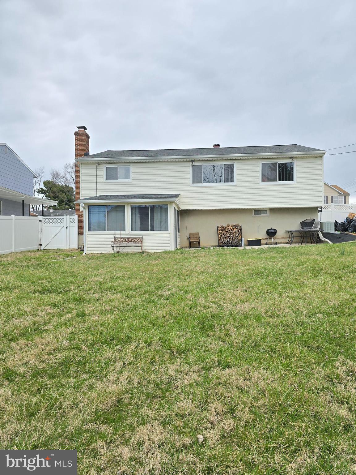 9003 Bruno Road Randallstown, MD 21133 - Photo 23 of 25 a house view with swimming pool in front of it