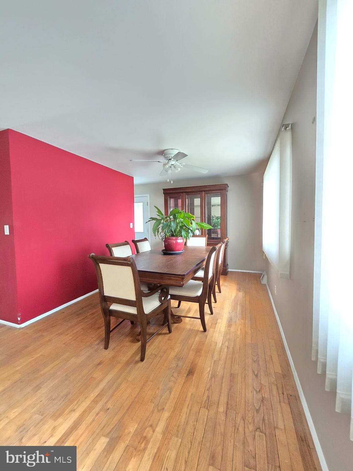 9003 Bruno Road Randallstown, MD 21133 - Photo 10 of 25 a view of a dining room with furniture and wooden floor