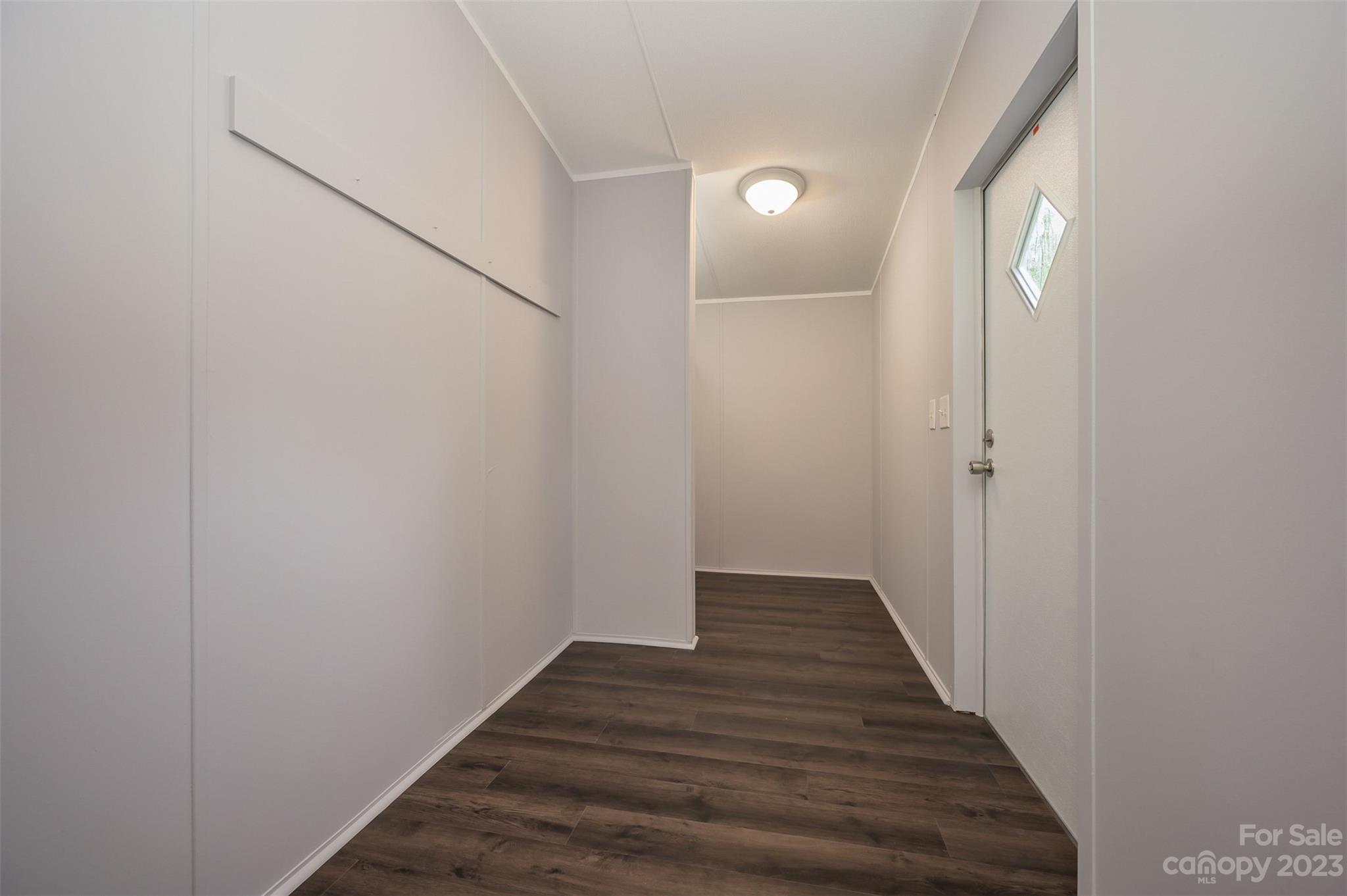 481 Brooks Road Bostic, NC 28018 - Photo 18 of 28 a view of a hallway with wooden floor