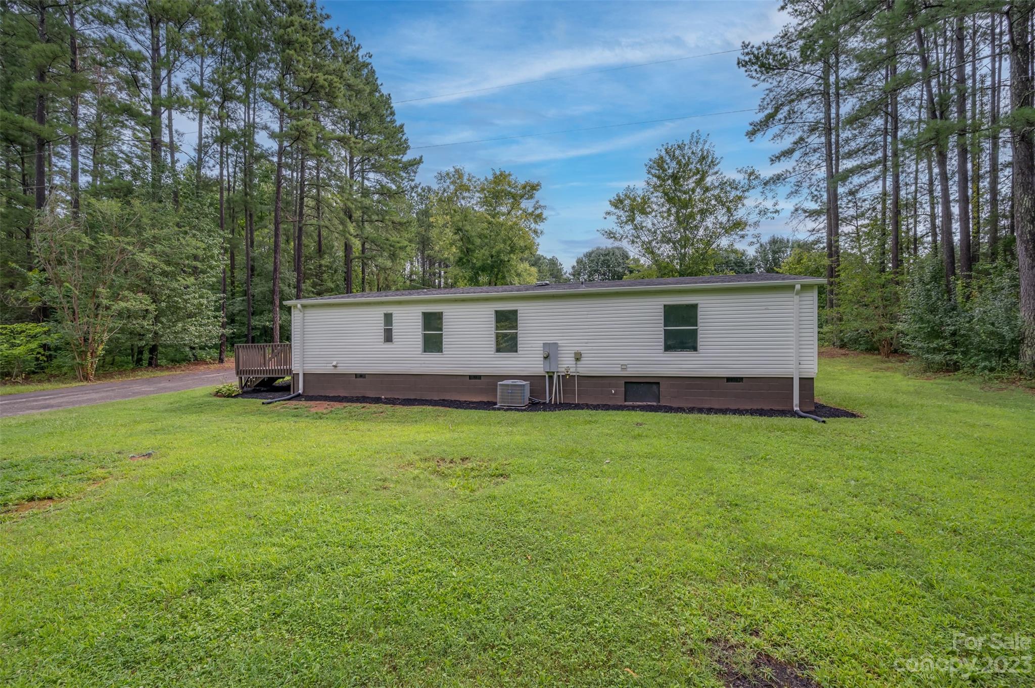 481 Brooks Road Bostic, NC 28018 - Photo 19 of 28 a front view of house with backyard and green space