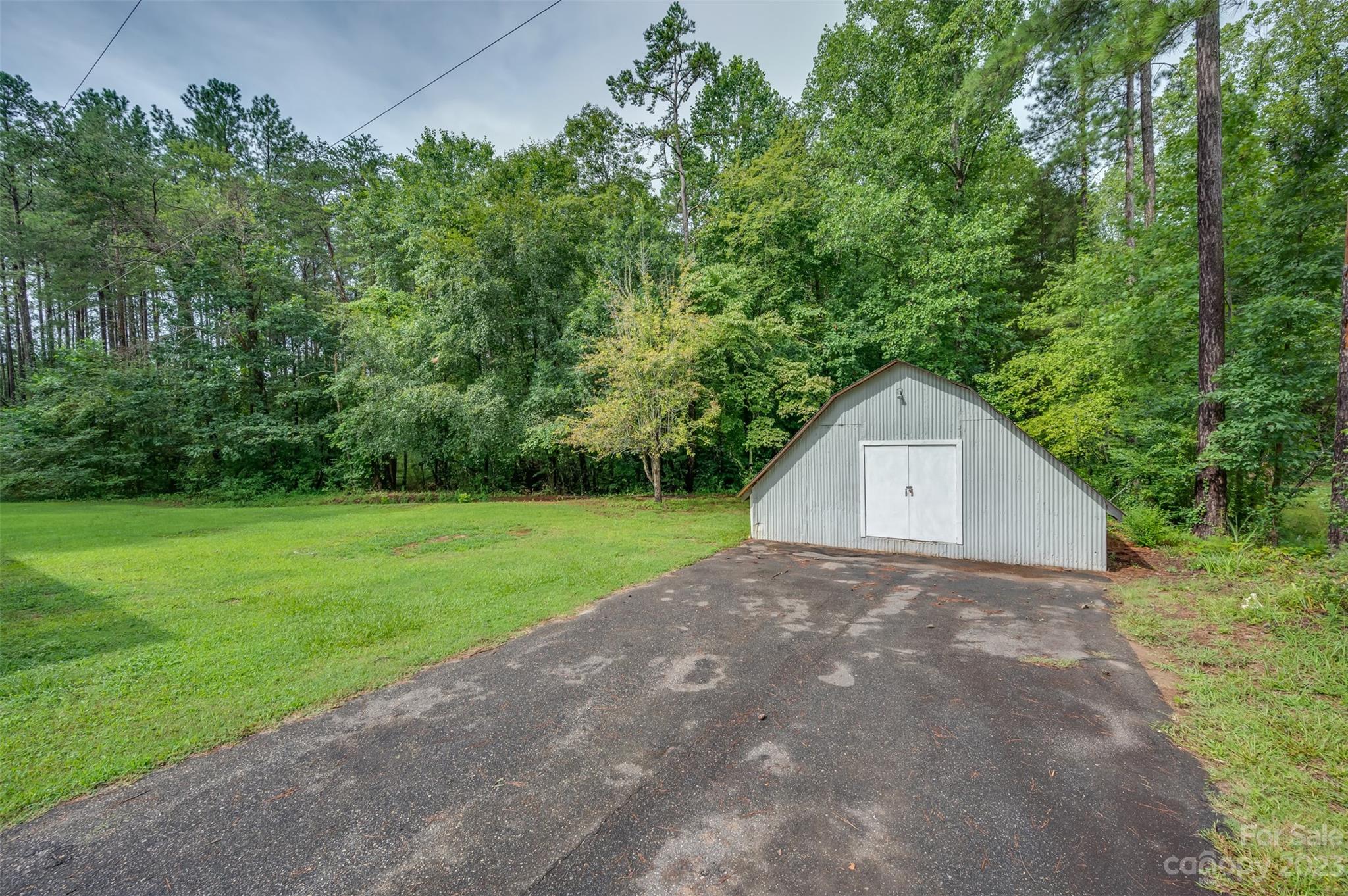 481 Brooks Road Bostic, NC 28018 - Photo 23 of 28 a view of a house with a yard and garage