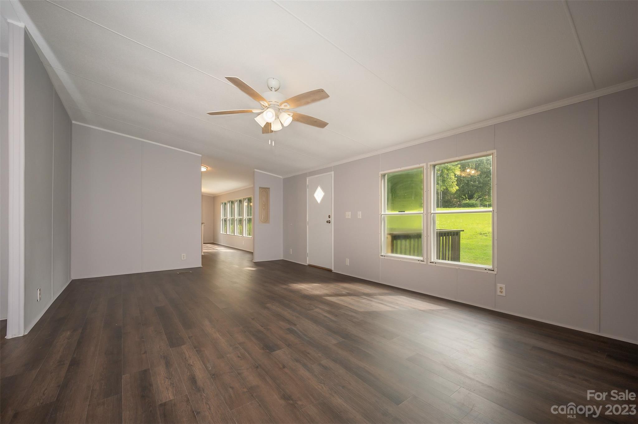 481 Brooks Road Bostic, NC 28018 - Photo 3 of 28 an empty room with wooden floor and windows