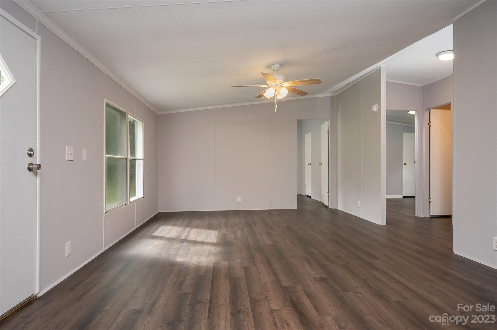 481 Brooks Road Bostic, NC 28018 - Photo 4 of 28 an empty room with wooden floor and windows
