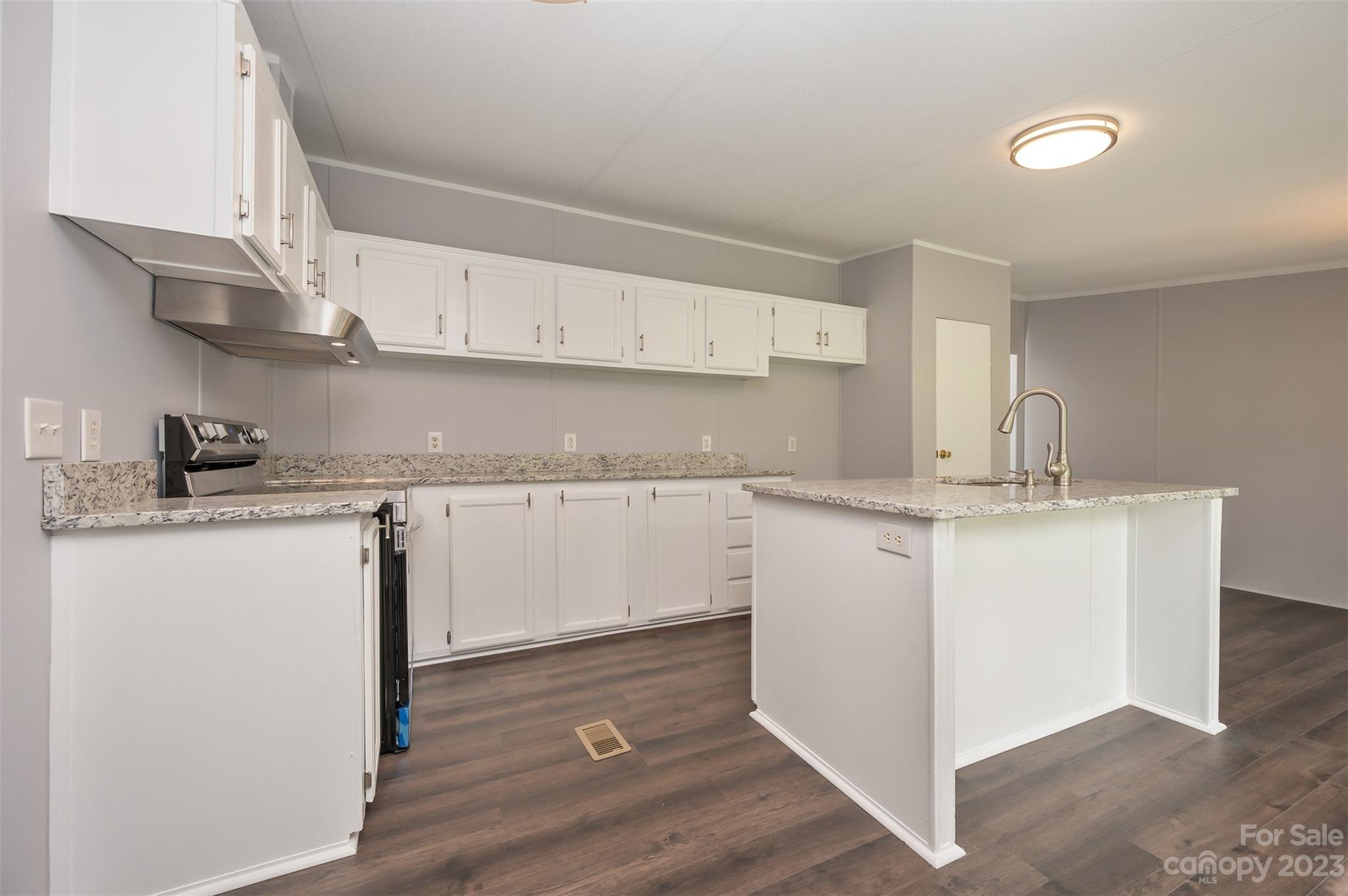 481 Brooks Road Bostic, NC 28018 - Photo 9 of 28 a kitchen with granite countertop a sink cabinets and stainless steel appliances