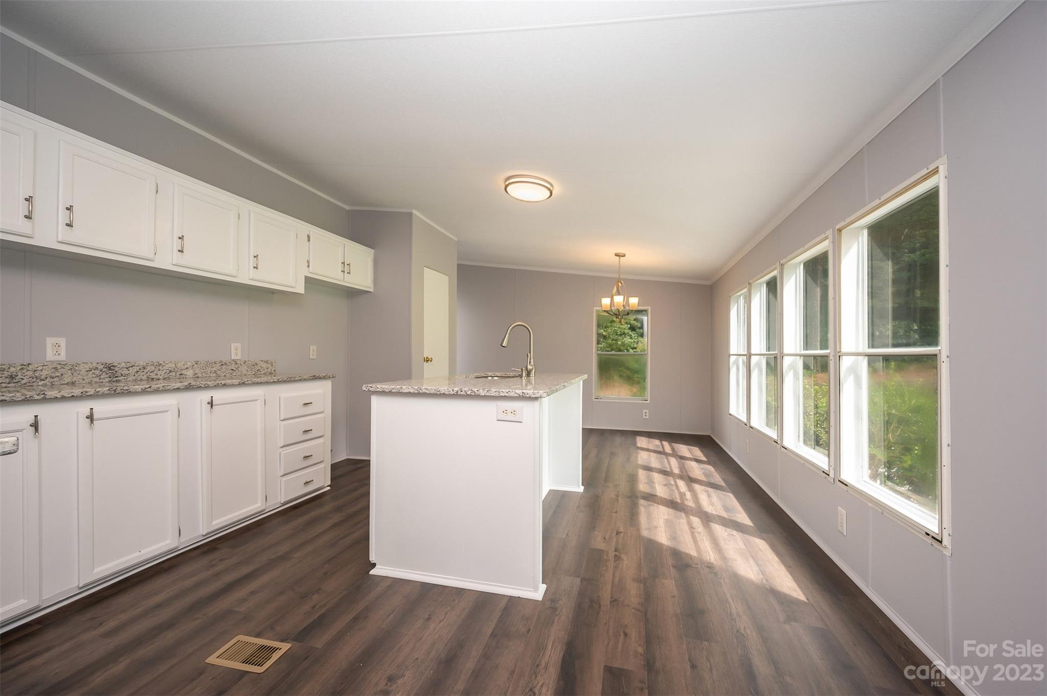 481 Brooks Road Bostic, NC 28018 - Photo 10 of 28 a view of a kitchen with wooden floor and electronic appliances
