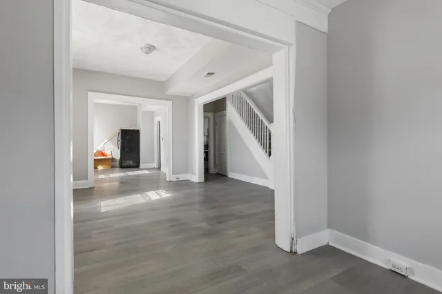 a view of a hallway view with staircase