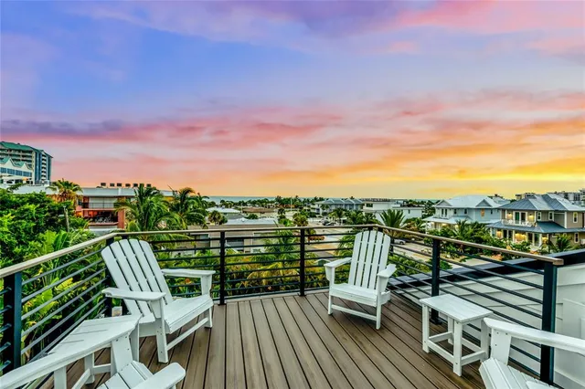 a view of a balcony with chairs