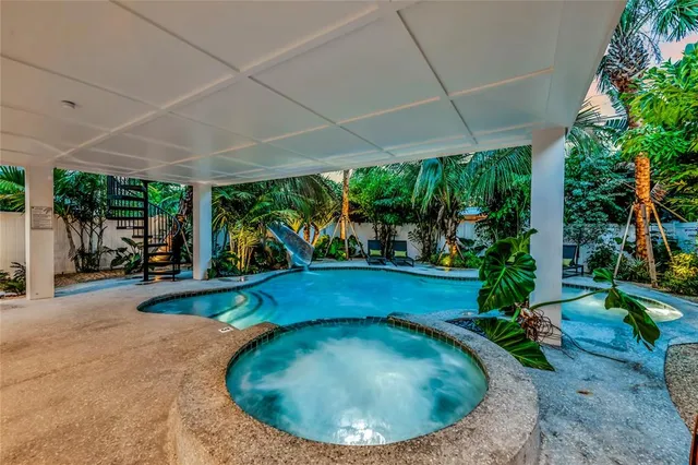 a view of a room with furniture and a large window