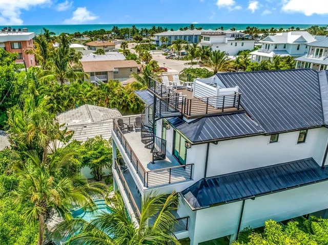 a view of a balcony with outdoor seating and city view