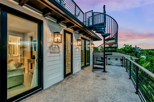 a view of staircase with a table and chairs