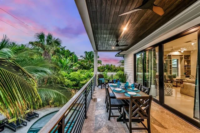 a view of a patio with a table and chairs