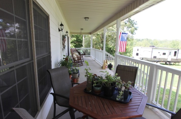 3157 Buckeye Road Erin, TN 37061 - Photo 3 of 41 a view of balcony with furniture and garden