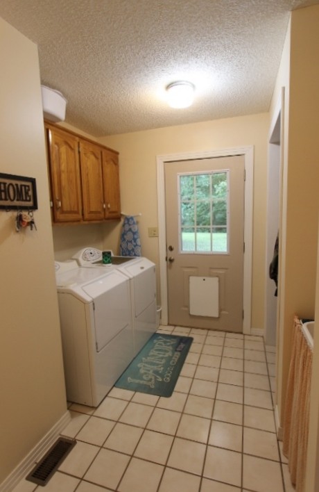 3157 Buckeye Road Erin, TN 37061 - Photo 23 of 41 a room with a washing machine and cabinets