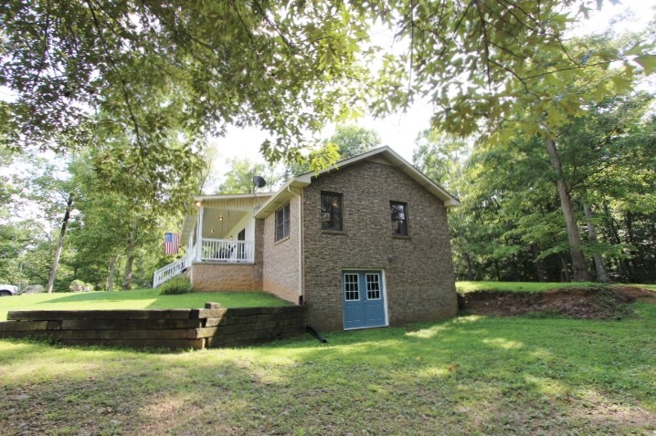 3157 Buckeye Road Erin, TN 37061 - Photo 28 of 41 a front view of a house with garden