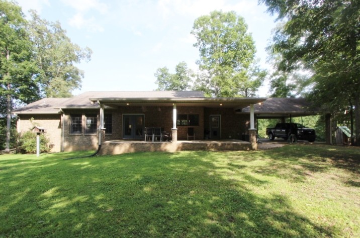 3157 Buckeye Road Erin, TN 37061 - Photo 29 of 41 a view of a house with a yard porch and sitting area