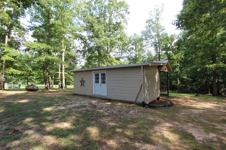 3157 Buckeye Road Erin, TN 37061 - Photo 33 of 41 a view of a barn in the back yard