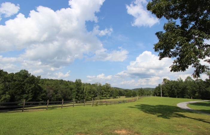 3157 Buckeye Road Erin, TN 37061 - Photo 36 of 41 a view of a golf course with a lake