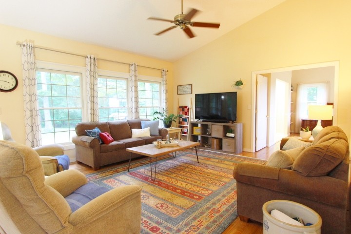 3157 Buckeye Road Erin, TN 37061 - Photo 6 of 41 a living room with furniture and a flat screen tv