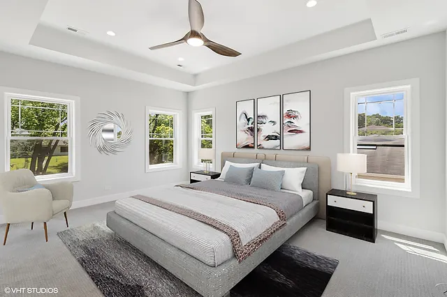 a bedroom with a large bed and a window