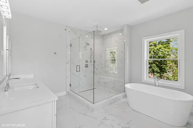a bathroom with a shower bathtub and sink