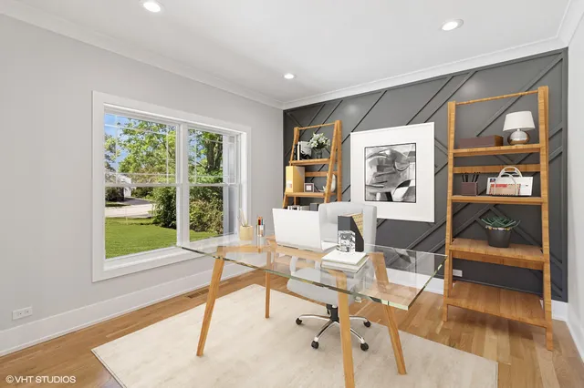 a living room with furniture and large windows