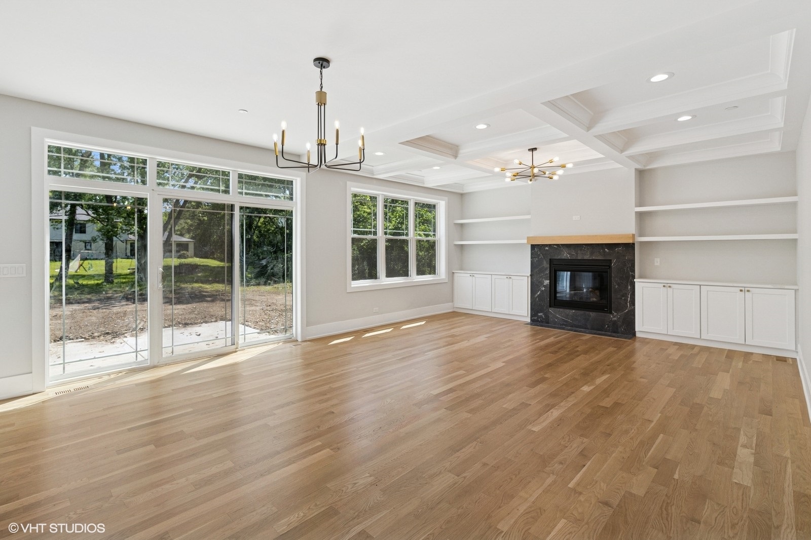 1816 Rosemary Road Highland Park, IL 60035 - Photo 7 of 35 a view of an empty room with wooden floor fireplace and a window