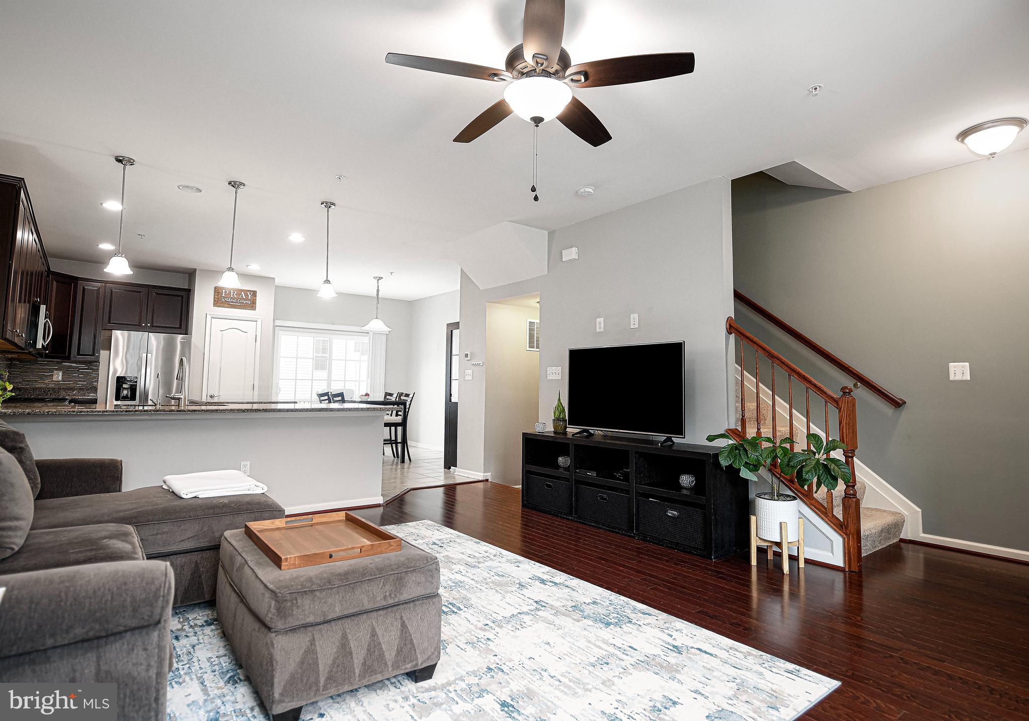 913 Morgan Run Road Middle River, MD 21220 - Photo 9 of 46 Living room w/hardwood & ceiling fan