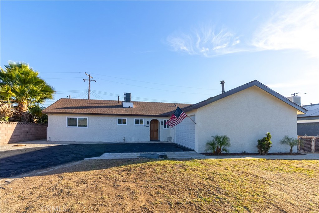 3306 Debbie Lane Riverside, CA 92501 - Photo 2 of 32 a front view of a house with garden