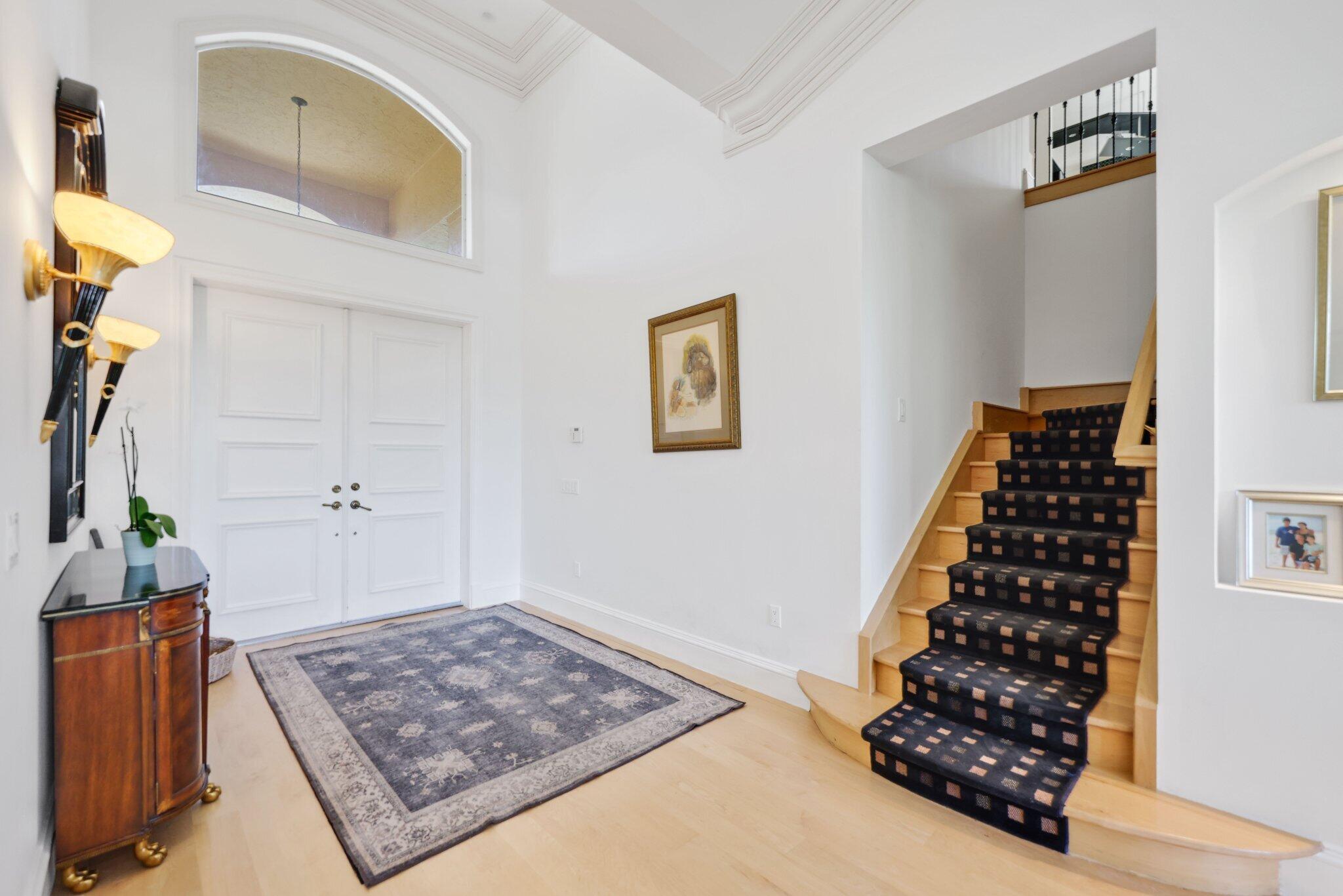 7355 Mandarin Drive Boca Raton, FL 33433 - Photo 13 of 18 a room with lots of cabinet and a rug