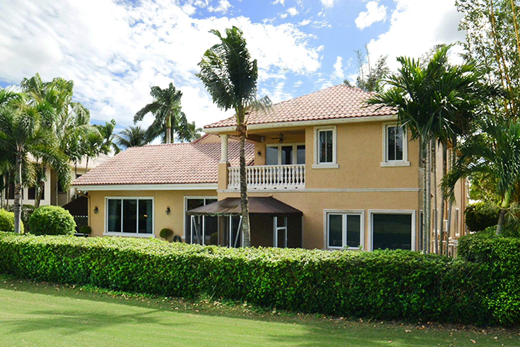 7355 Mandarin Drive Boca Raton, FL 33433 - Photo 2 of 18 a front view of a house with a yard