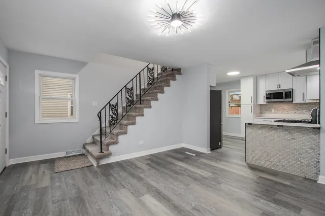 a view of a kitchen with a sink cabinets and a window