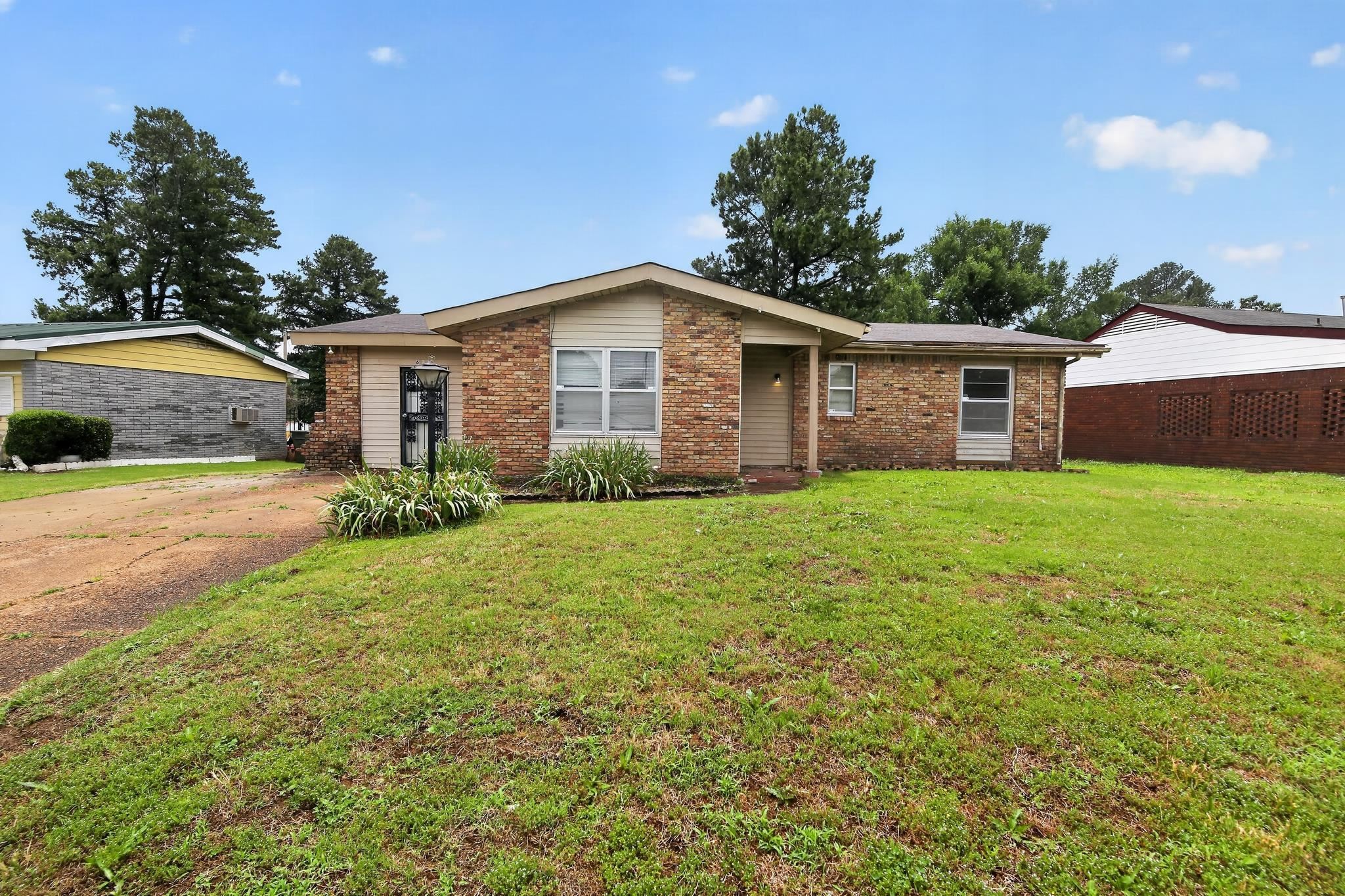 645 Parkrose Road Memphis, TN 38109 - Photo 1 of 32 Brick exterior facade with light beige siding accents