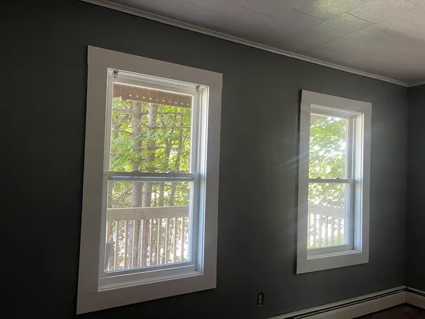 a view of an empty room with a window
