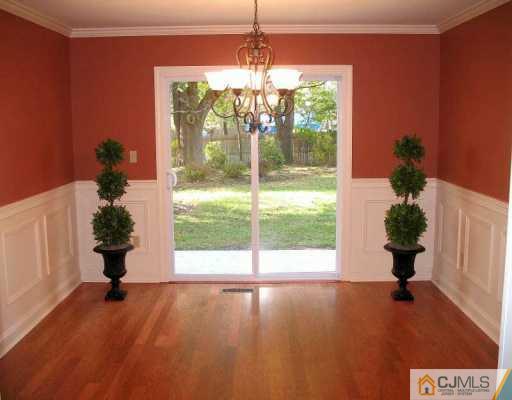 1 Hughes Road Somerset, NJ 08873 - Photo 3 of 8 a view of an empty room with a potted plant
