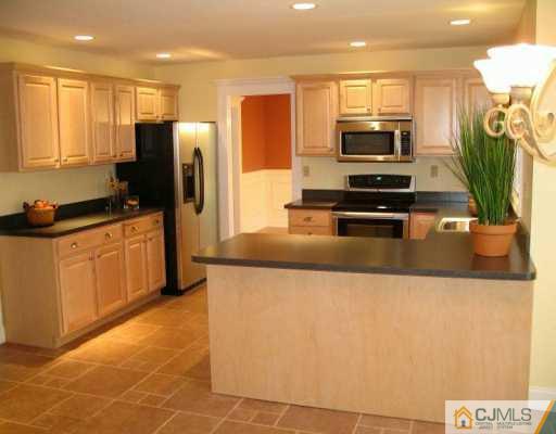 1 Hughes Road Somerset, NJ 08873 - Photo 4 of 8 a kitchen with stainless steel appliances a refrigerator a stove top oven a sink and dishwasher