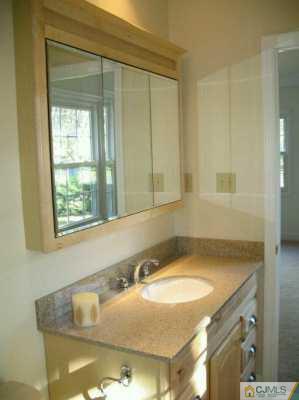 1 Hughes Road Somerset, NJ 08873 - Photo 7 of 8 a bathroom with a granite countertop sink and a bathtub